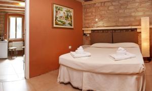 Voodi või voodid majutusasutuse Albergo Garni Orchidea toas