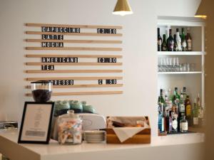 a bar with bottles of alcohol on a wall at Linton Lodge a BW Signature Collection Hotel in Oxford +88 photos