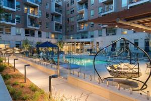 a swimming pool with a playground in a building at E Cambridge 2BR w Gym WD nr Lechmere T BOS-636 in Boston