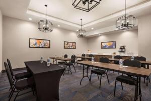 a conference room with tables and chairs and lights at La Quinta Inn & Suites by Wyndham Del Rio in Del Rio +57 photos