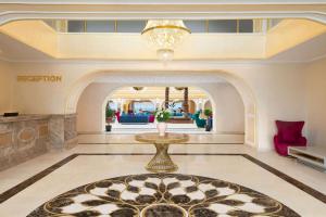 a lobby of a hotel with a chandelier at Ramada Plaza by Wyndham Silivri in Silivri