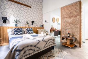 A bed or beds in a room at Edificio Conde 7- Plaza de la Merced