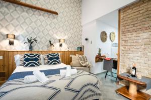 A bed or beds in a room at Edificio Conde 7- Plaza de la Merced