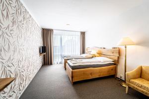 Postel nebo postele na pokoji v ubytování Hotel Fontána