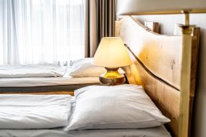 Postel nebo postele na pokoji v ubytování Hotel Fontána