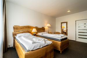 Postel nebo postele na pokoji v ubytování Hotel Fontána