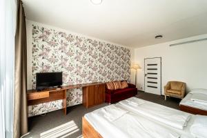 Postel nebo postele na pokoji v ubytování Hotel Fontána