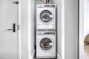 two washing machines and a washer and dryer in a room at Park Slope 2BR w WD nr Barclays Center NYC-908 in Brooklyn