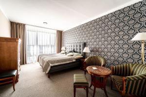 Postel nebo postele na pokoji v ubytování Hotel Fontána