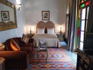 Postel nebo postele na pokoji v ubytování Riad Meyssane Fès
