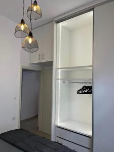 A kitchen or kitchenette at Helios Stays - Sisi Private Apartments