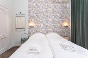 A bed or beds in a room at Studio Anvers