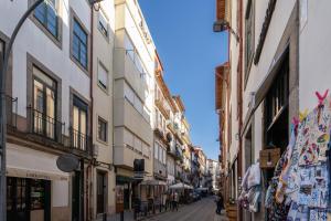 a street in an old town with buildings at Magnificent Sunny Flat - Douro River in Vila Nova de Gaia
