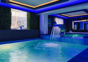 a hot tub with a waterfall in a room at Diuna Beskidy Ustroń - dawny Kolejarz in Ustroń +61 photos