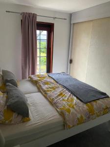 Ένα ή περισσότερα κρεβάτια σε δωμάτιο στο Ferienhaus Wippendorf