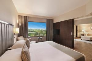 Postel nebo postele na pokoji v ubytování Hyatt Regency Delhi