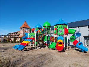 a playground with a bunch of play equipment at Flaming in Rowy