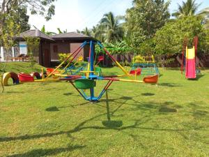 a group of playground equipment in a yard at Doola River Edge in Udawalawe