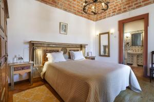a bedroom with a large bed and a bathroom at Quinta de Santa Barbara in Constância +187 photos