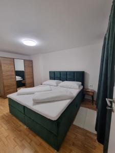 Posteľ alebo postele v izbe v ubytovaní Apartman Šćuric