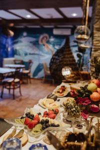 a table with several plates of food on it at Hotel Pleamar in Puerto de Vega