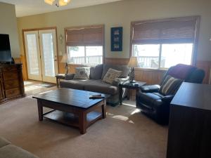 a living room with a couch and a coffee table at Making Memories in Red River