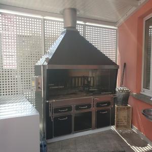 a kitchen with a large stove in a room at Ristorante Gordolese con alloggio in Gordola