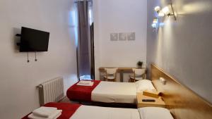 Posteľ alebo postele v izbe v ubytovaní Paraiso Hostel