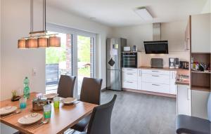a kitchen and dining room with a table and chairs at Beautiful Home In Bleckede With Wifi in Bleckede