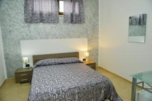 Postel nebo postele na pokoji v ubytování B&B Colori del Salento