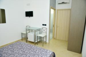 Postel nebo postele na pokoji v ubytování B&B Colori del Salento