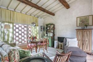 a living room with a couch and a table at Settignano Tuscany Homes in Settignano