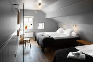 Postel nebo postele na pokoji v ubytování Hotell Käringön