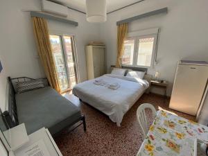 Кровать или кровати в номере Sunset view Rooms