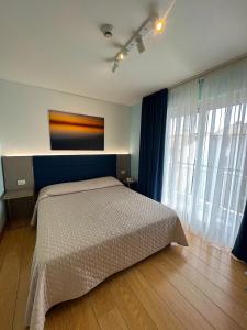 Łóżko lub łóżka w pokoju w obiekcie Hotel Regina
