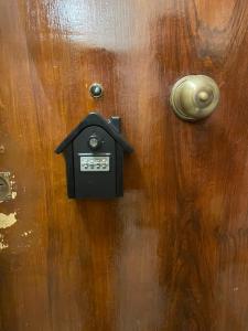 a wooden door with a black mailbox on it at Casa Viesseux in Florence