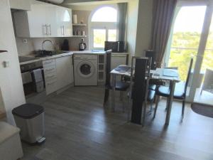 a kitchen with a table and a dining room at Mountain View in Alvor