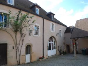 a large house with a driveway in front of it at Misty in Asquins