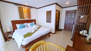 Postel nebo postele na pokoji v ubytování Southern Comfort Patong