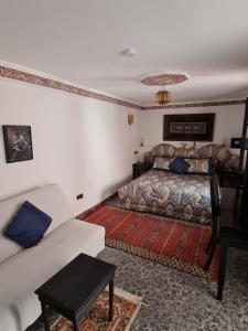 Postel nebo postele na pokoji v ubytování Riad Kanata
