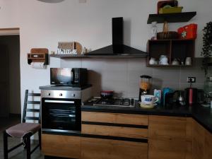 Kuchyň nebo kuchyňský kout v ubytování B&B Libellula + 37 fotografií
