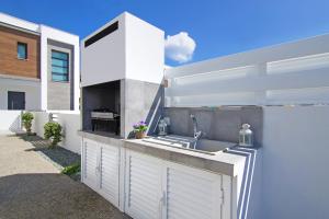 a kitchen in a house with a sink and aestead at Villa Martha in Protaras