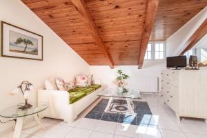 a living room with a couch and a table at Étienne Apartment in Central Location in Zakynthos