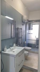 Kylpyhuone majoituspaikassa Apartment MariLù
