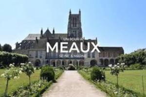 a large building with the word mexx on it at Key-s Meaux/Atypique/Centre-ville/Gare in Meaux