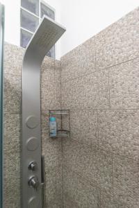 a shower with a shower head in a bathroom at Spiagge Iblee in Marina di Ragusa