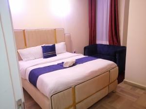 Postel nebo postele na pokoji v ubytování Nash Issah Homes-1BedRoom