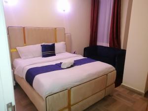 Postel nebo postele na pokoji v ubytování Nash Issah Homes-1BedRoom