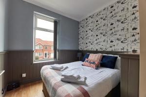 Una cama o camas en una habitación de Millbank House - 3 bed home from home