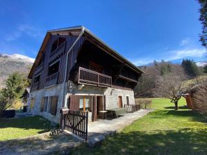 a large building with a fence in front of it at Chalet Savoyard avec Cheminée et Parking à Samoëns - FR-1-624-80 in Samoëns